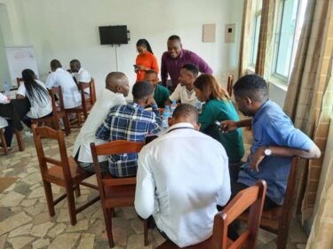 Health workers participating in a SAIA cascade analysis meeting in Mozambique