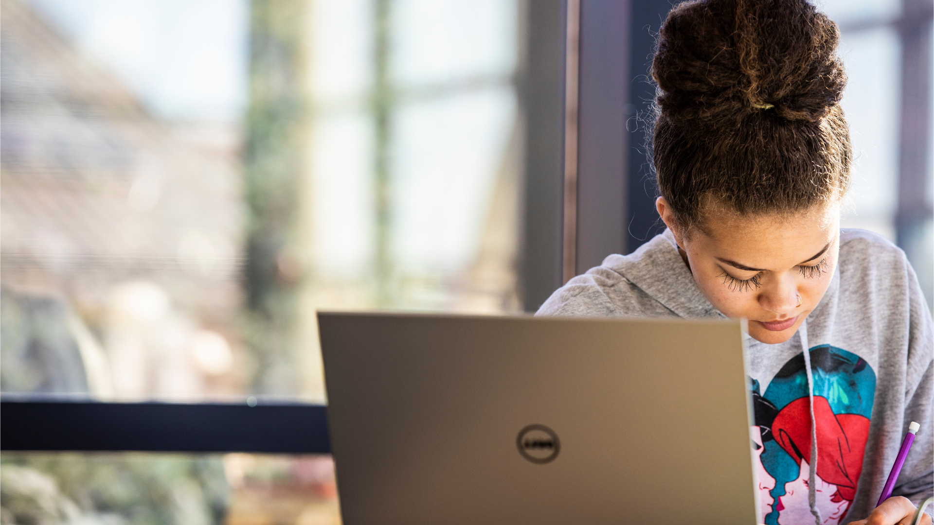 person in front of a laptop