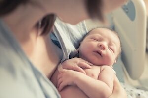 person holding infant