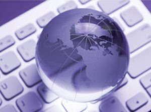 glass world globe on top of keyboard