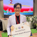 Inthira with a "Second Place Research Award Winners" certificate