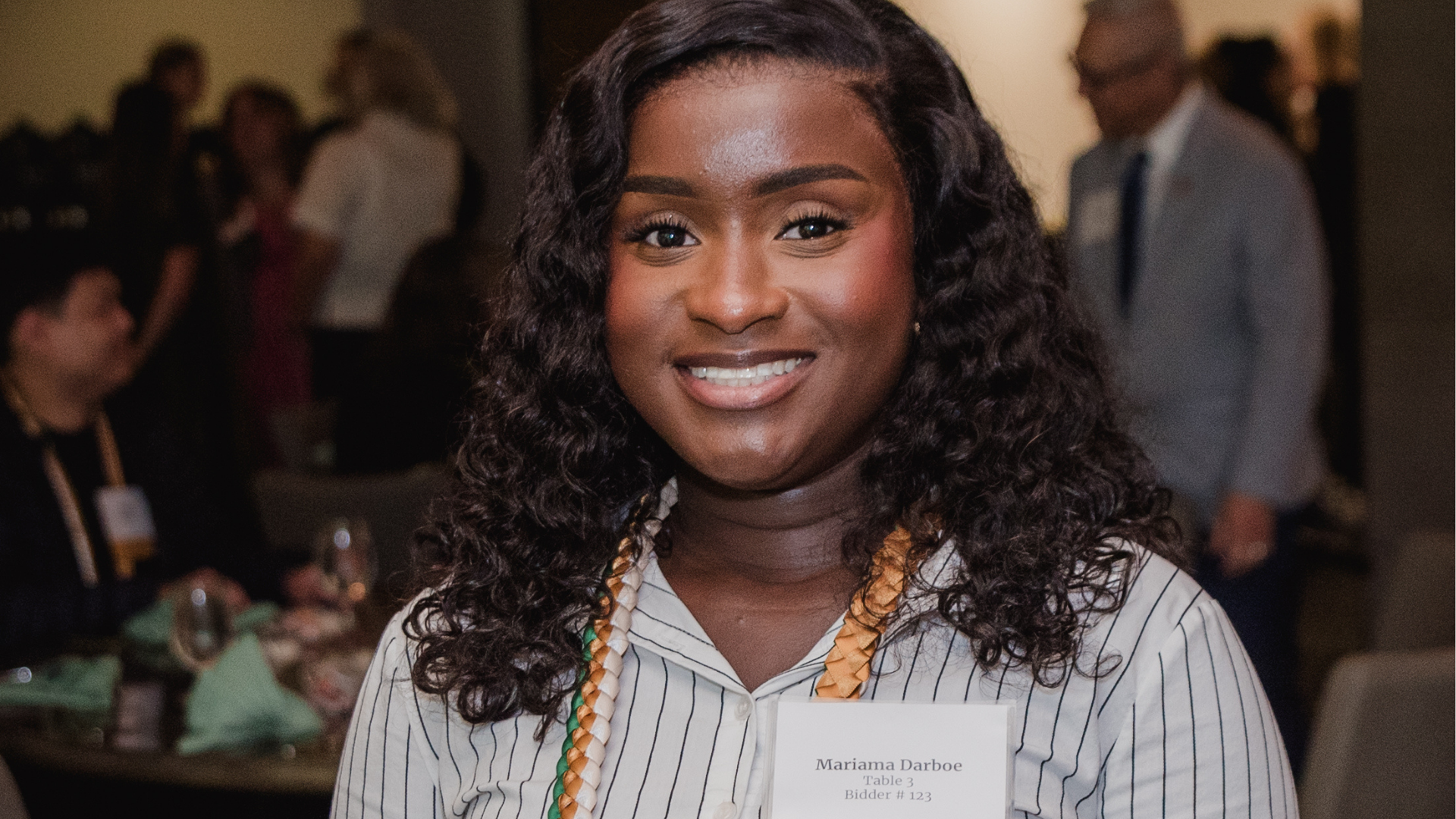 A woman posing and smiling directly at the camera.