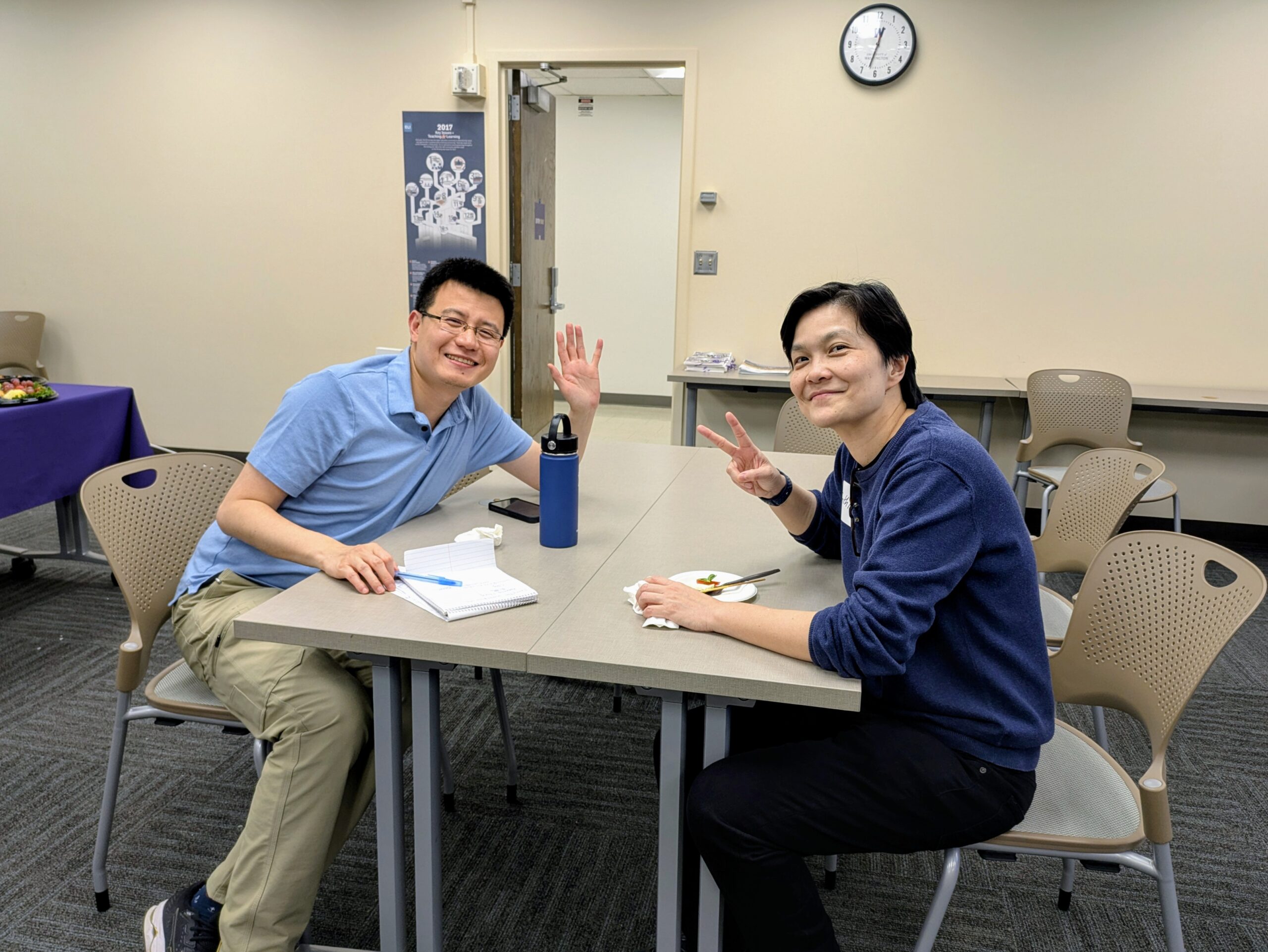 Two people smiling at a table